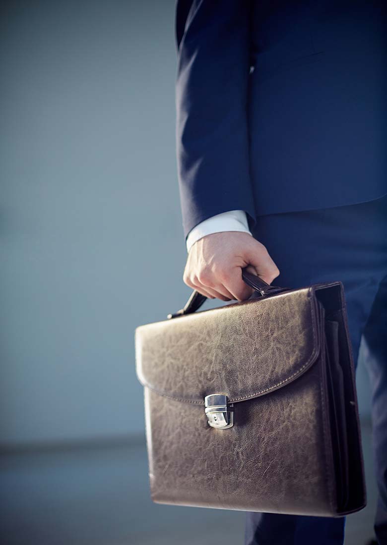 close-up-of-businessman-holding-briefcase