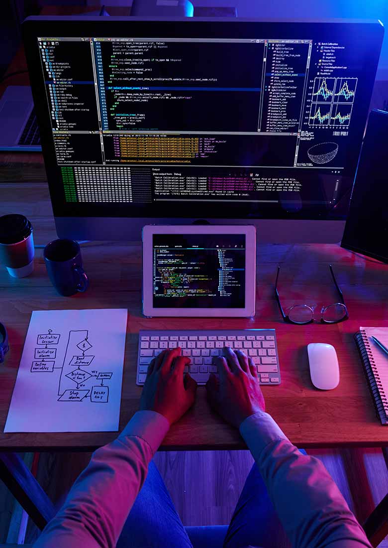 top-view-of-unrecognizable-hacker-performing-cyberattack-at-night